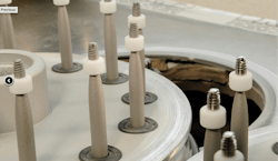 Figure 4: After being milled in the CNC machine, the implants are blasted and etched for maximum surface area and roughness. Figure 4: After being milled in the CNC machine, the implants are blasted and etched for maximum surface area and roughness.