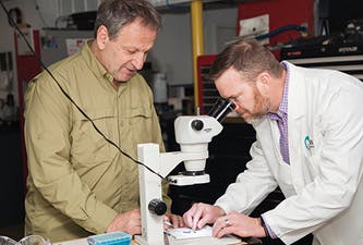 Figure 6: Drs. Dostal and Williams inspect implant-related components at the iHex 1 and MorsTorq (iH Biomedical) manufacturing facility in the upper Midwest.
