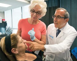 Figure 7: AAFE President Dr. Louis Malcmacher teaching techniques at a live-patient Botox and dermal filler training course