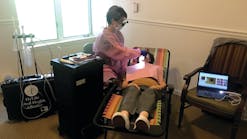 Michele Wildes, RDH, CDP, an employee of HyLife Oral Health Alliance, treats a senior patient