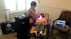 Michele Wildes, RDH, CDP, an employee of HyLife Oral Health Alliance, treats a senior patient