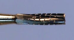 Figure 1: The no. 557 bur has been used in dentistry for many years, and some dentists still consider it to be desirable for operative dentistry. However, other burs shown in Figure 2 have been shown to be better for use in high-speed air and electric handpieces. Figure 1: The no. 557 bur has been used in dentistry for many years, and some dentists still consider it to be desirable for operative dentistry. However, other burs shown in Figure 2 have been shown to be better for use in high-speed air and electric handpieces.