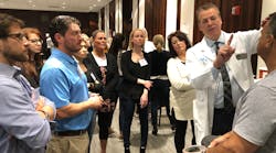 AAFE faculty member Dr. Peter Harnois teaches Botox to attendees at the ADA headquarters.