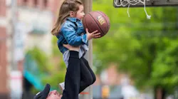 Dr. Nacho playing basketball with his 3-year-old daughter.
