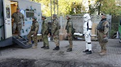 A queue of soldiers (one even sporting a Star Wars costume) for mobile dental clinic Tryzub Dental.