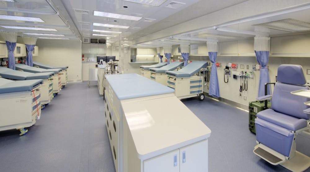 Wide interior of a mobile hospital with a state-of-the-art surgical suite, satellite communication capabilities, and more.