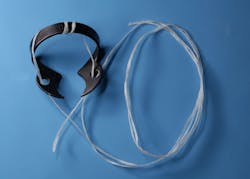 Figure 18: Ligated clamp depicting the holes and bow secured with floss Figure 18: Ligated clamp depicting the holes and bow secured with floss