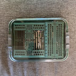 Figure 4: All endodontic instruments are shown packed away and covered with a locking lid onto my procedure tray. Figure 4: All endodontic instruments are shown packed away and covered with a locking lid onto my procedure tray.