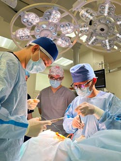 Dr. Kawamura, a Japanese volunteer, performs an oral surgery in Dnipro hospital, Ukraine.