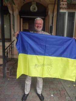 Dr. Horbenko with his award, a flag signed by Commander-in-Chief of the Armed Forces of Ukraine General Valerii Zaluzhnyi.