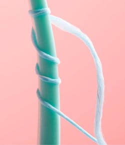 Figure 2: Cocolab’s Cocofloss has a woven design that allows for greater plaque and food removal than standard waxed floss. This design also helps identify overhangs in composite restorations by snagging on them and indicating the need for further interproximal adjustment. Figure 2: Cocolab’s Cocofloss has a woven design that allows for greater plaque and food removal than standard waxed floss. This design also helps identify overhangs in composite restorations by snagging on them and indicating the need for further interproximal adjustment.