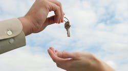 Person handing over keys Person handing over keys