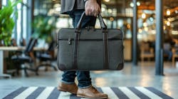 Man holding a briefcase Man holding a briefcase