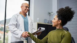 Smiling patient and dentist shaking hands. Smiling patient and dentist shaking hands.