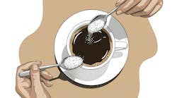 putting a spoonful of sugar in a coffee cup putting a spoonful of sugar in a coffee cup