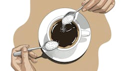 putting a spoonful of sugar in a coffee cup putting a spoonful of sugar in a coffee cup