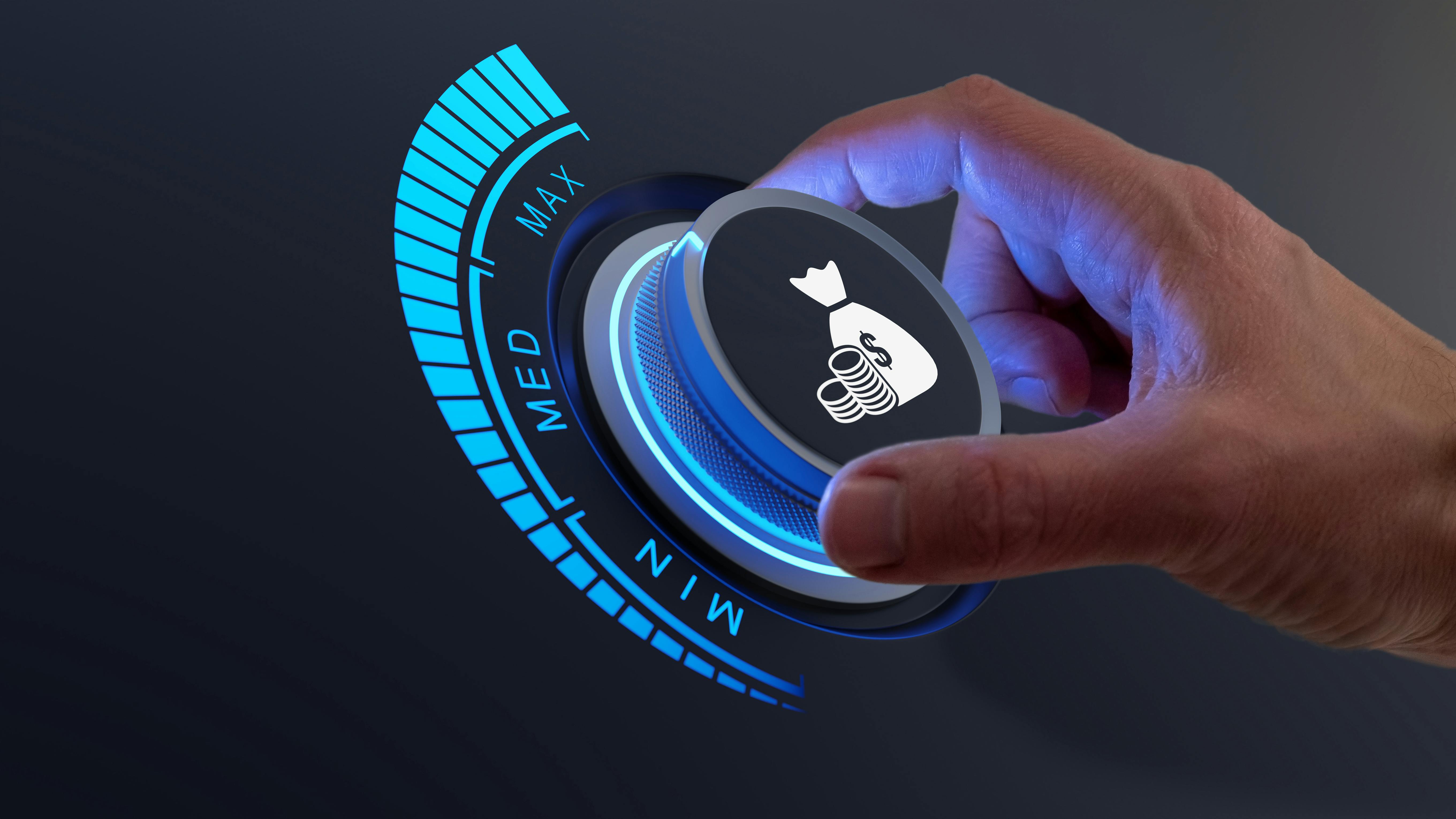 Hand turning up dial on practice profits