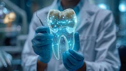 dentist holding a hologram of a tooth dentist holding a hologram of a tooth