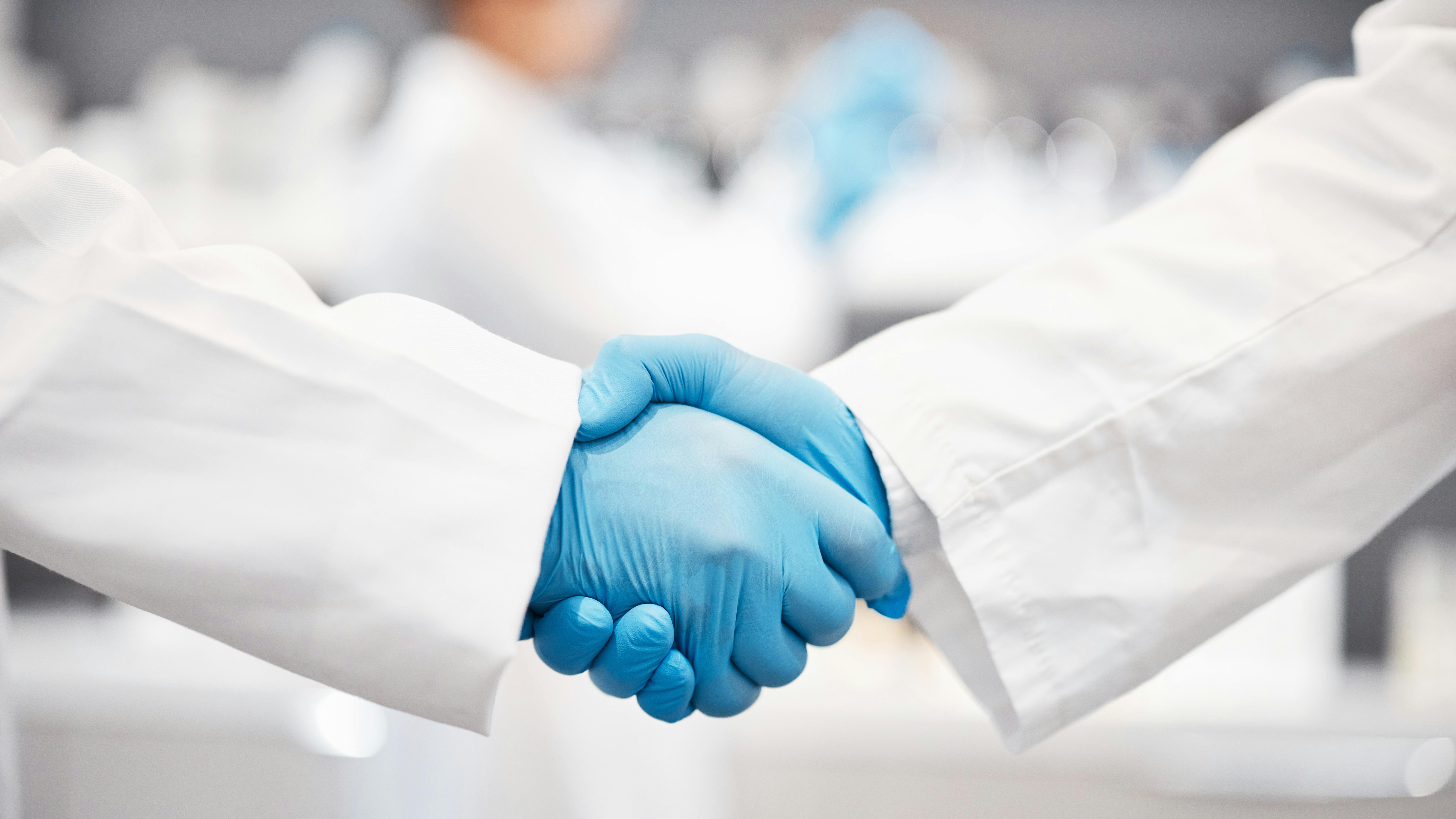 two dentists shaking hands