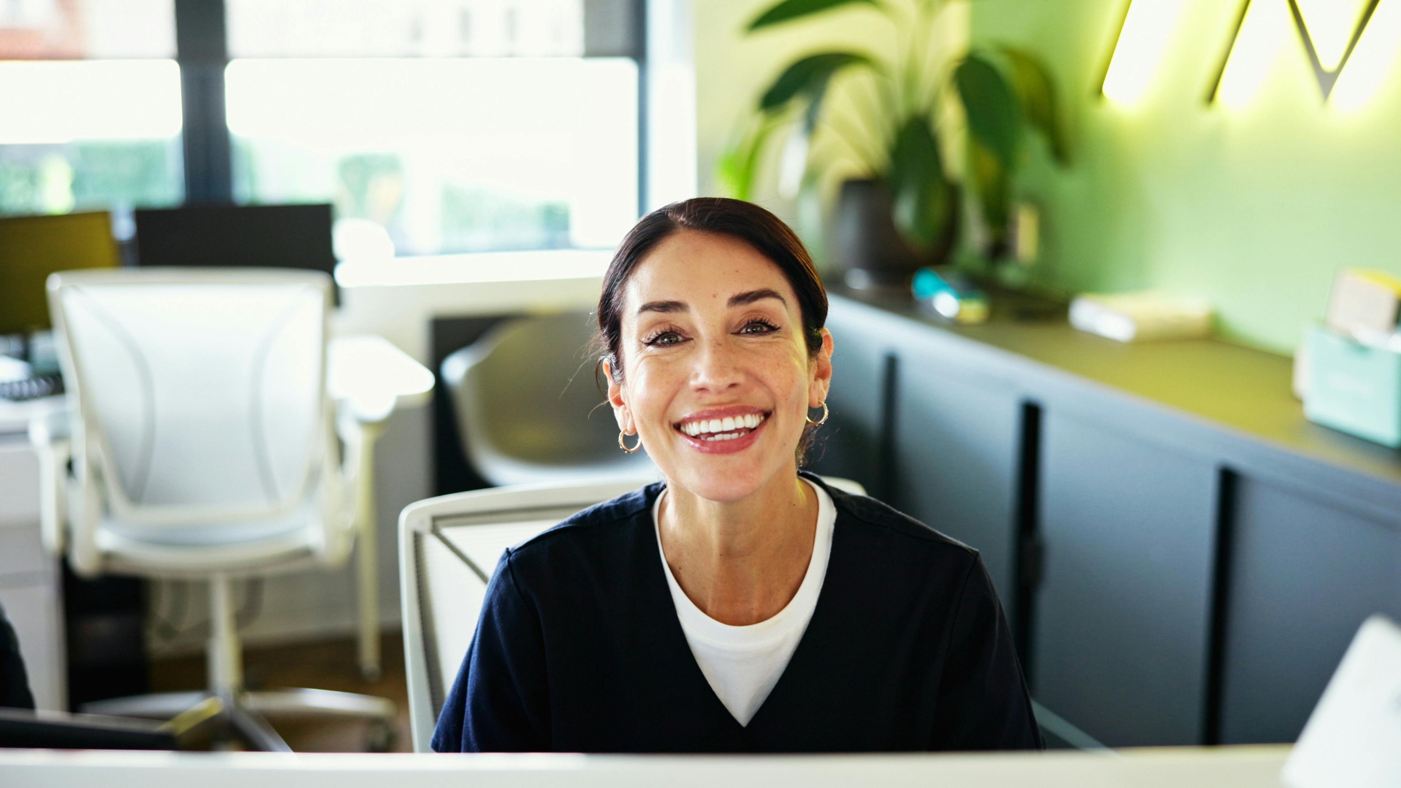Smiling dental practice front office worker