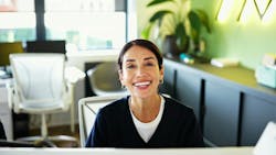 Smiling dental practice front office worker Smiling dental practice front office worker