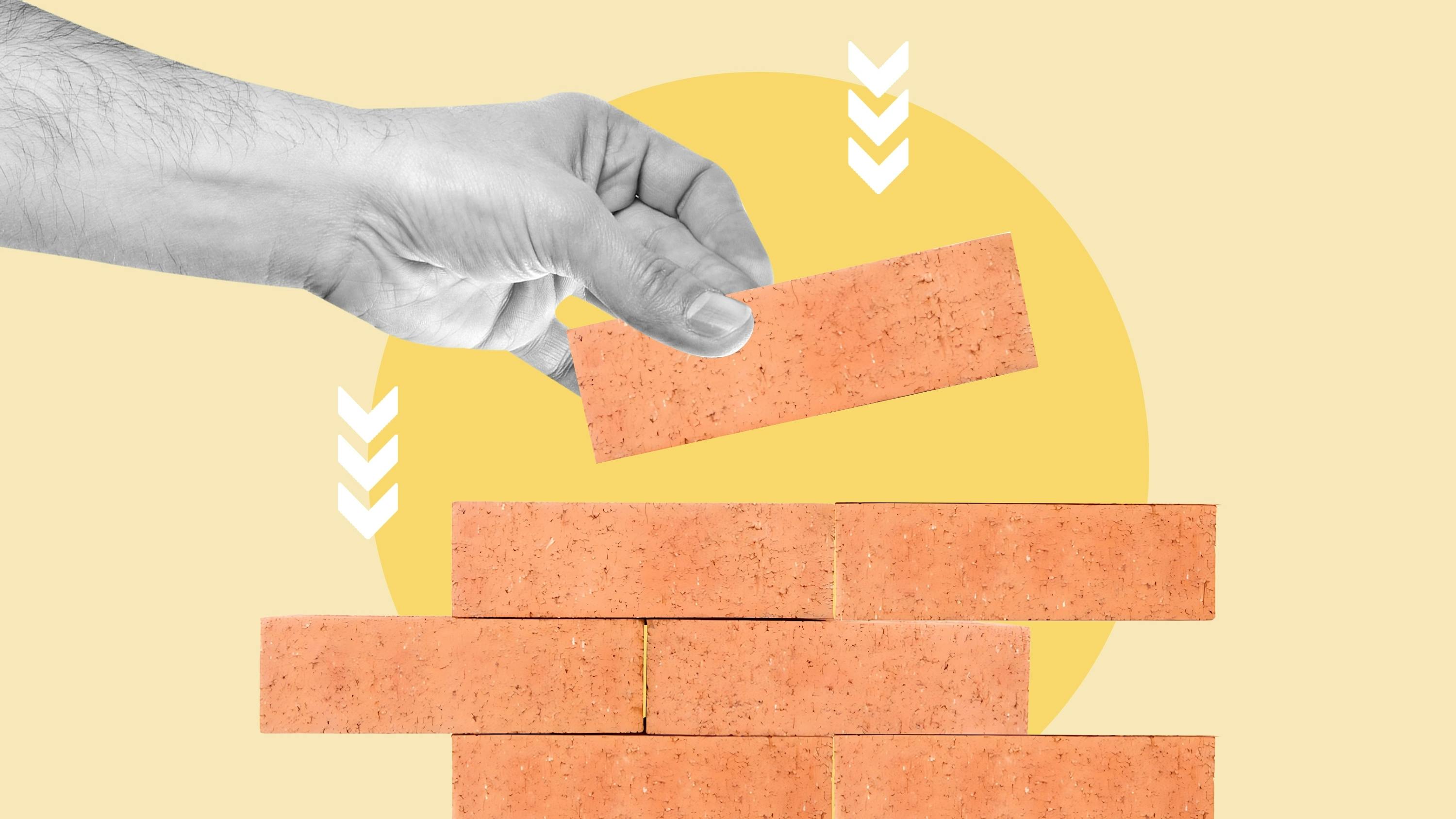 illustration of a hand stacking bricks