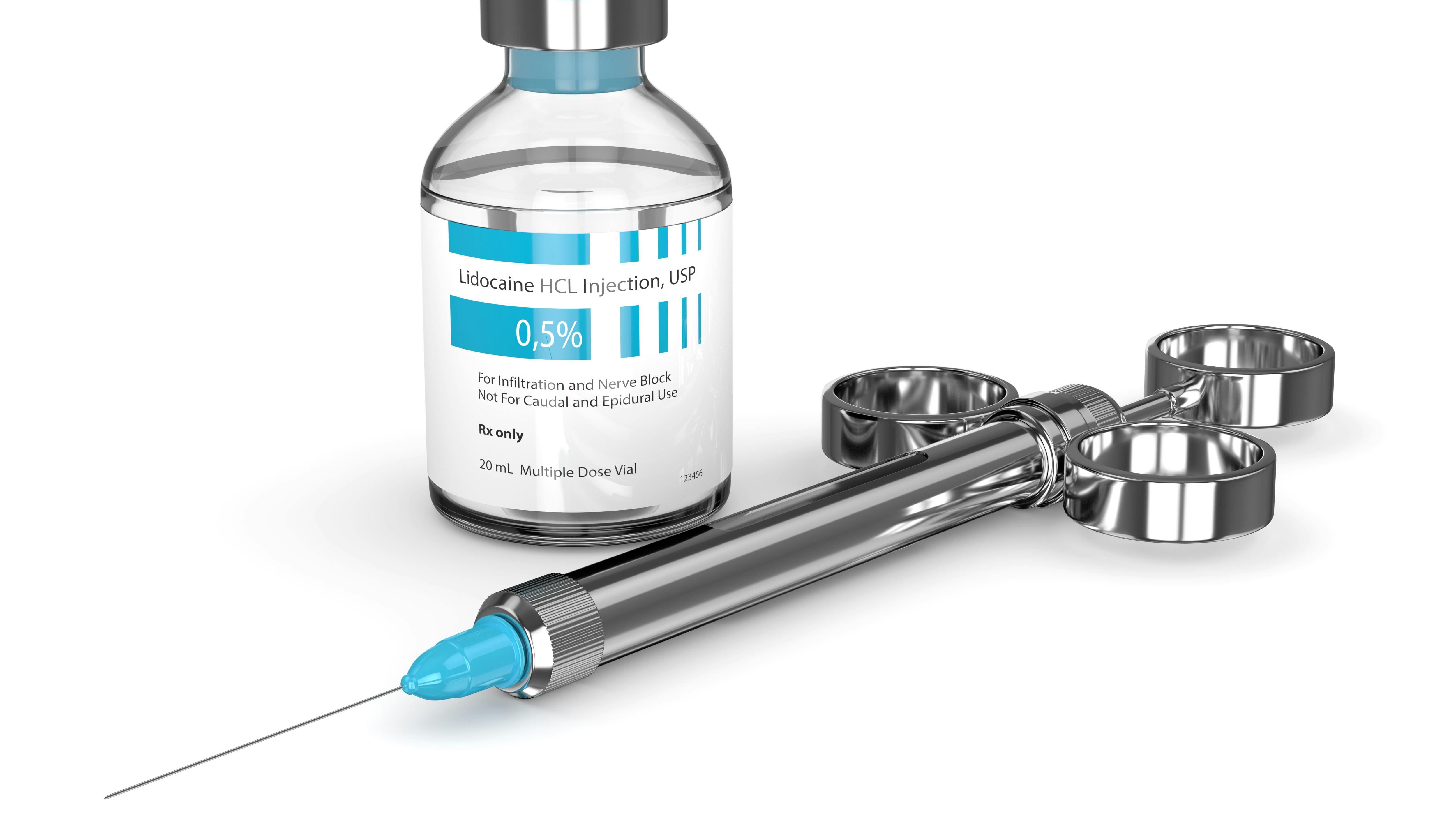a syringe and a jar of anesthetic