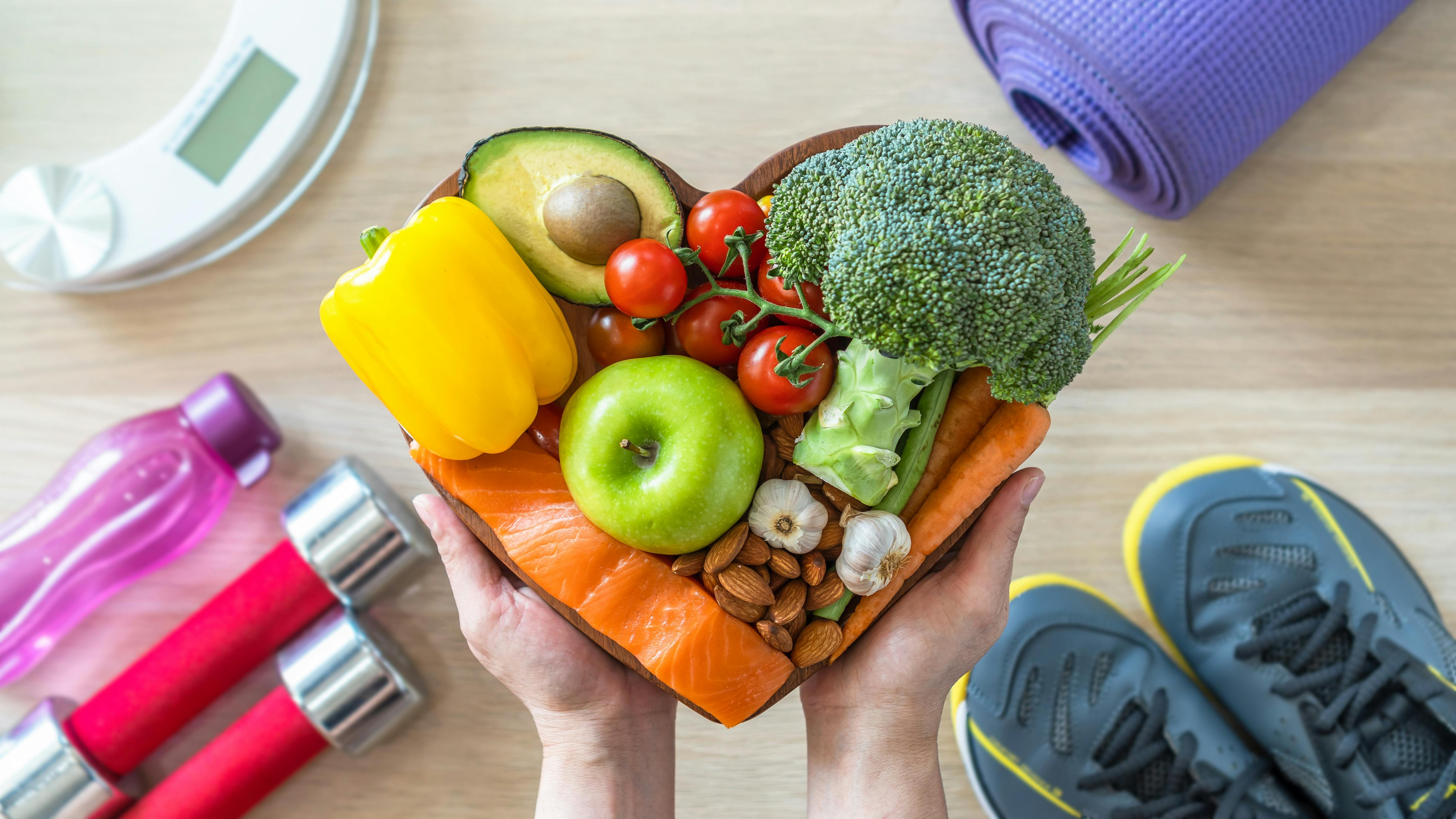 a montage of healthy images&mdash;healthy foods, exercise shoes, water bottle, and other concepts denoting a healthy lifestyle