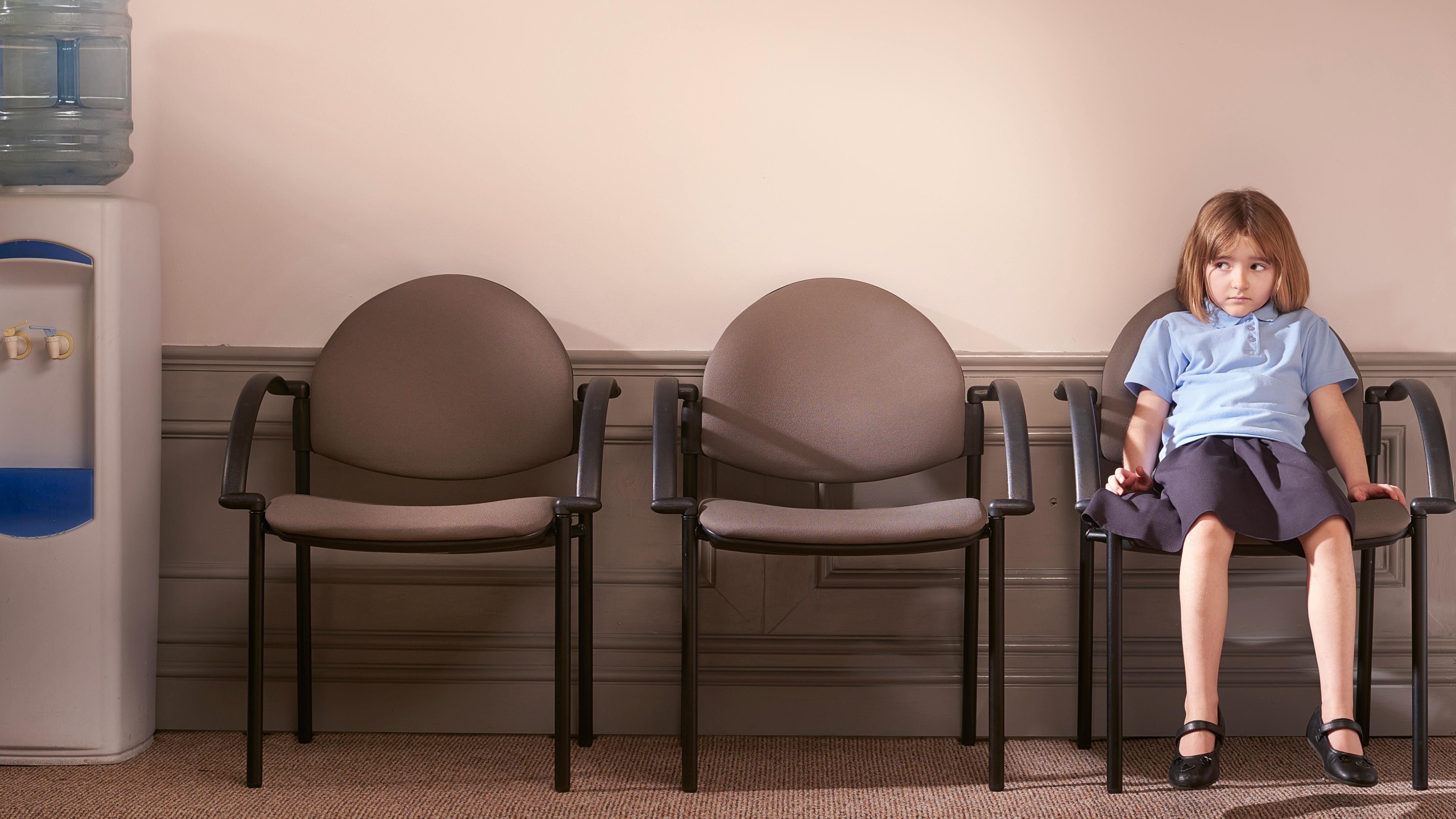 girl sitting in waiting room