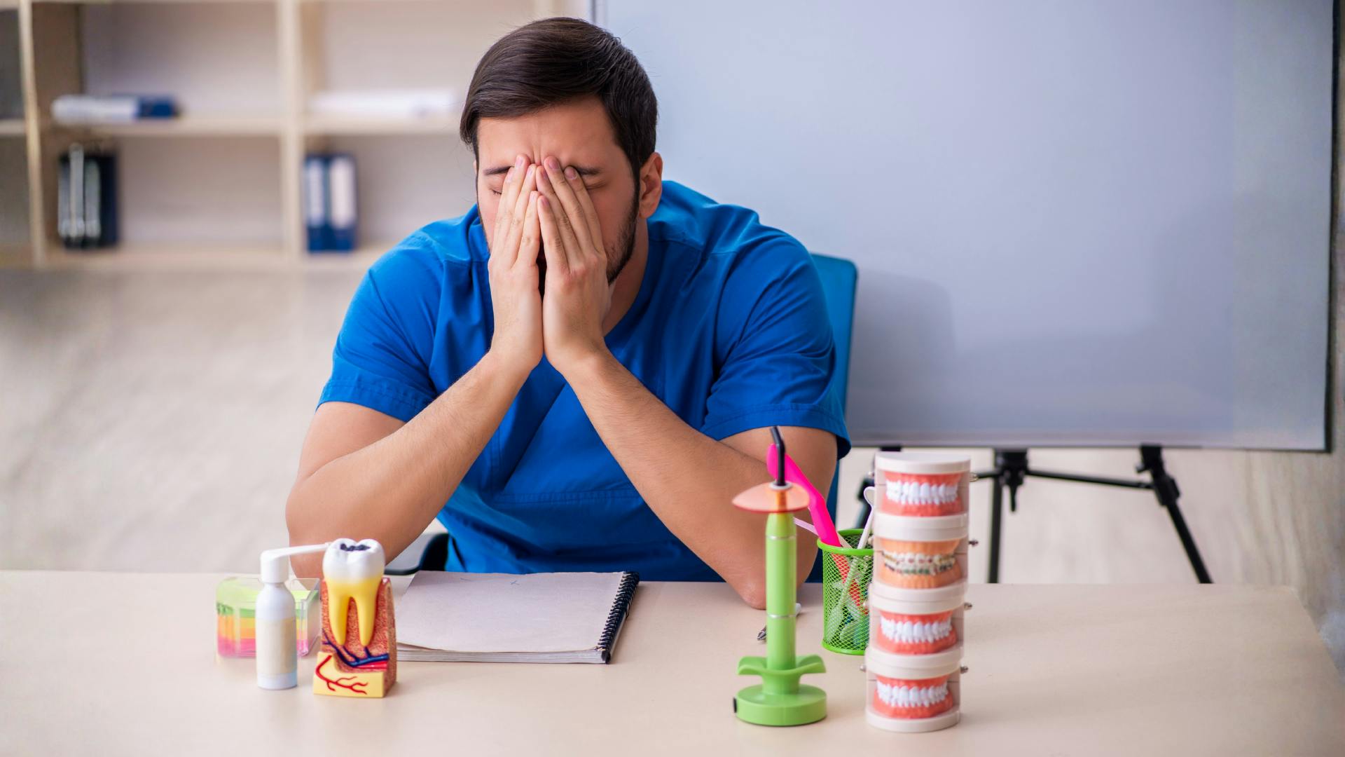 Frustrated dentist at desk