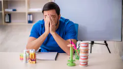 Frustrated dentist at desk