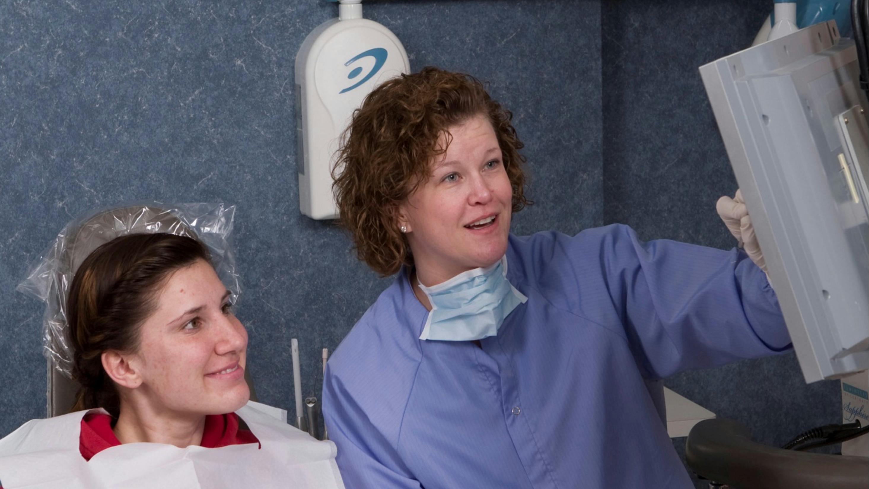 dentist providing patient education to a patient
