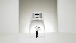 Man trapped underneath a glass on a tabletop