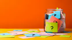a jar with colorful notes with question marks on them