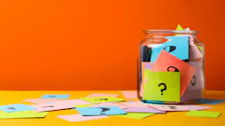 a jar with colorful notes with question marks on them