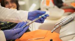 dentist preparing a local anesthetic for a dental patient
