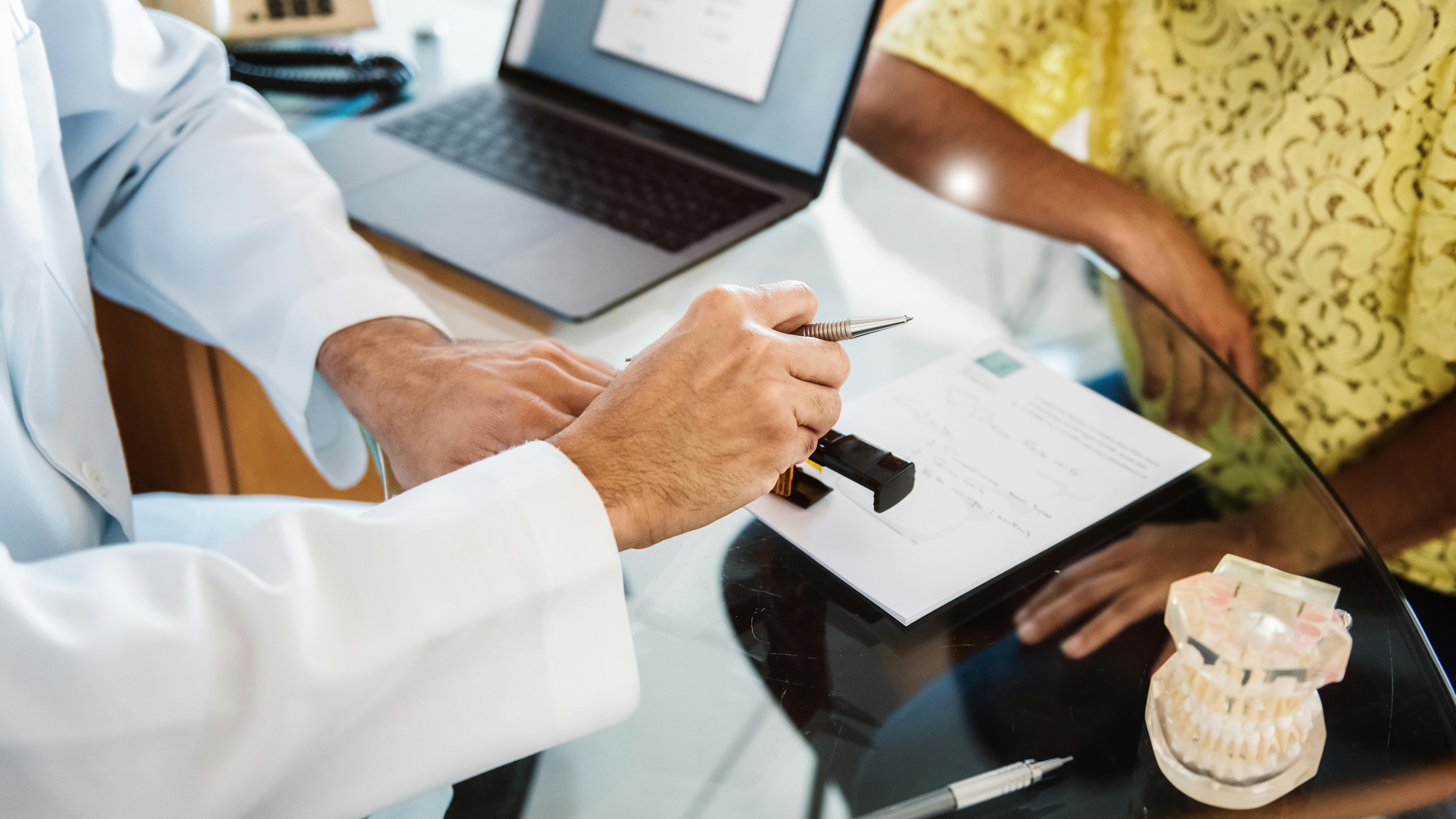 Dentist and lawyer reviewing paperwork